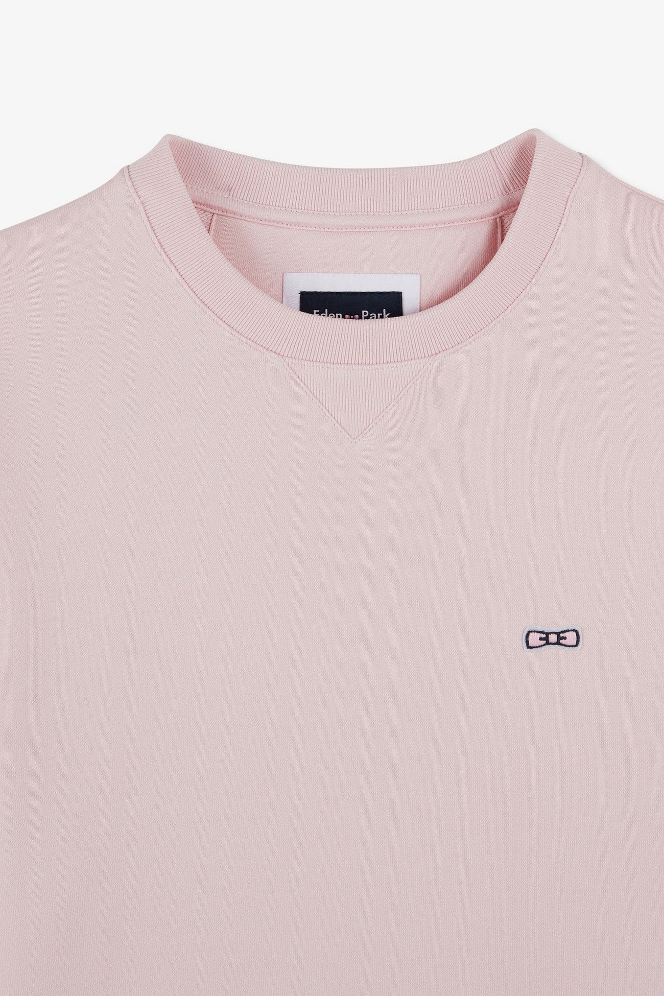 Pink fleece round-neck sweatshirt with bow tie embroidery