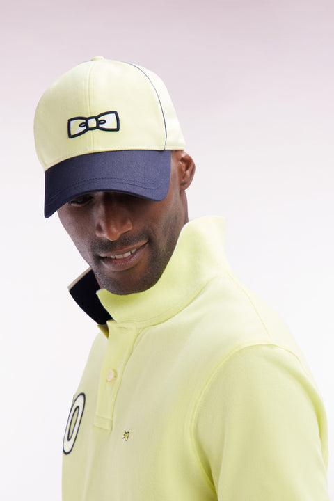 Yellow cotton jersey cap with striped bow tie logo - Image 1