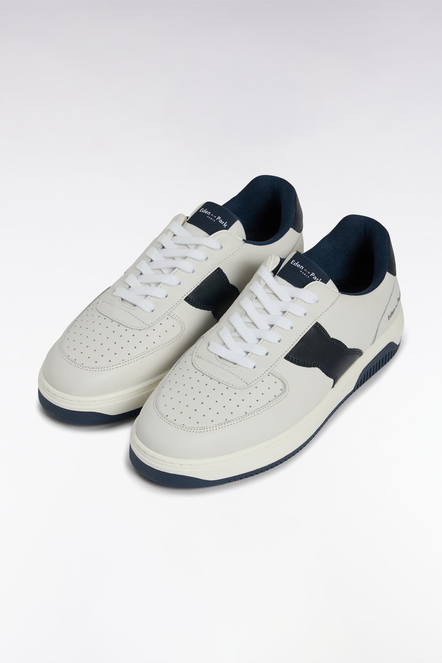 White leather sneakers with black details
