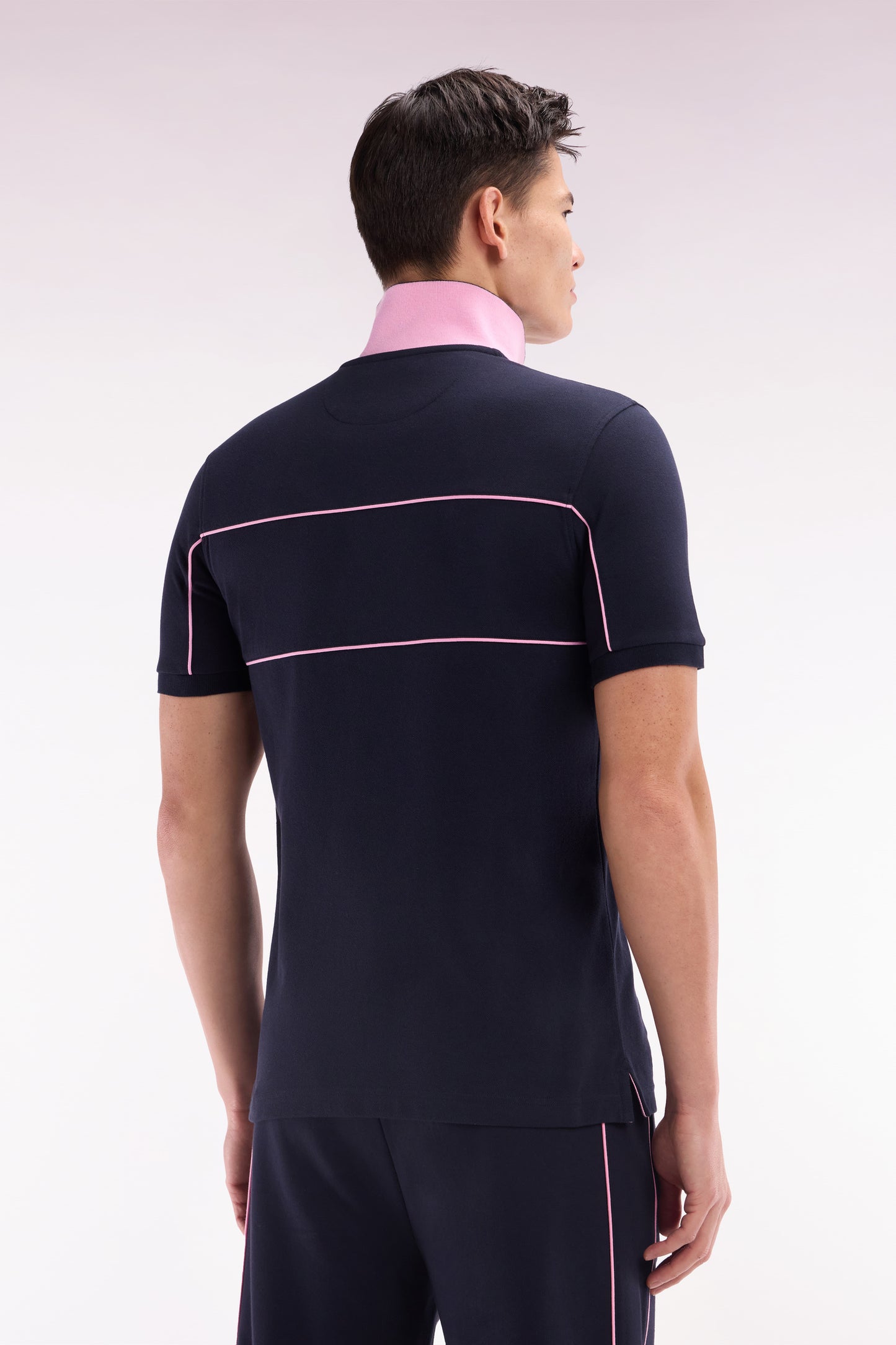 Straight-fit short-sleeved polo shirt in navy cotton piqué with piped cut-outs