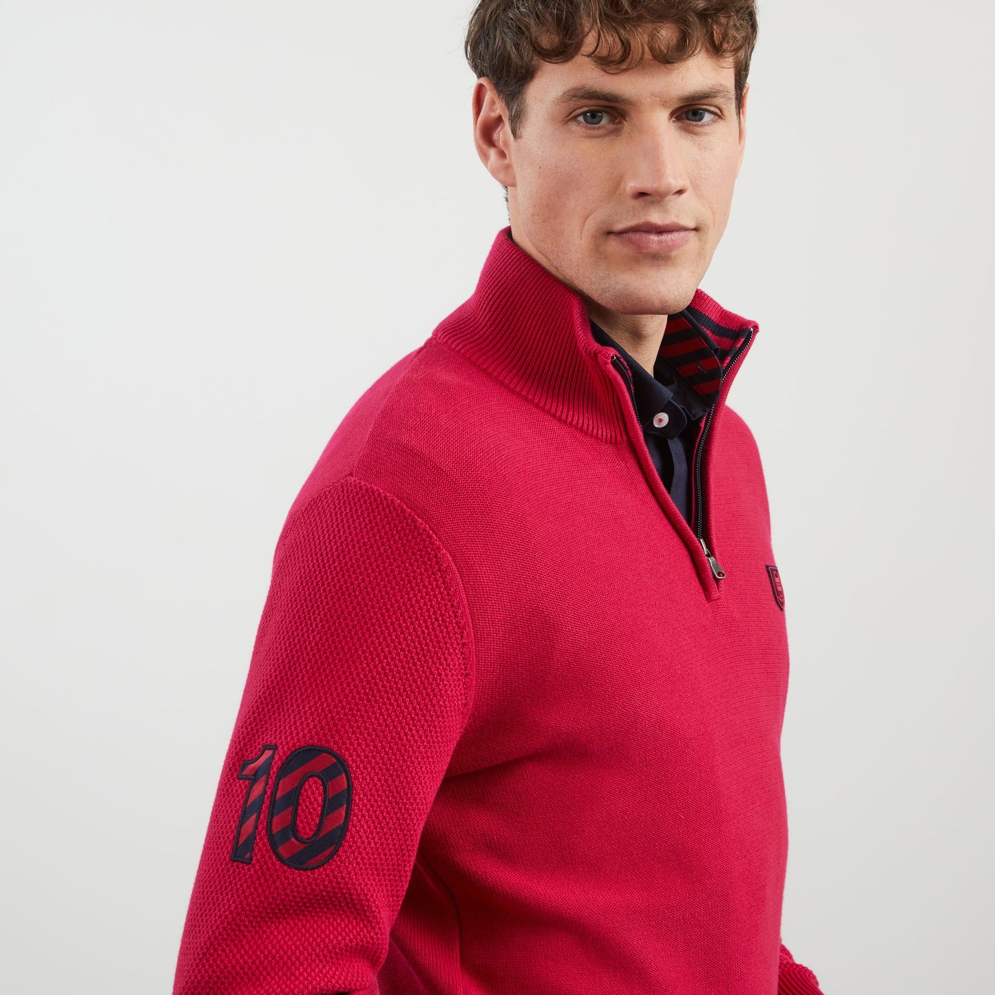 Dark pink zip-neck jumper with no. 10 embroidery