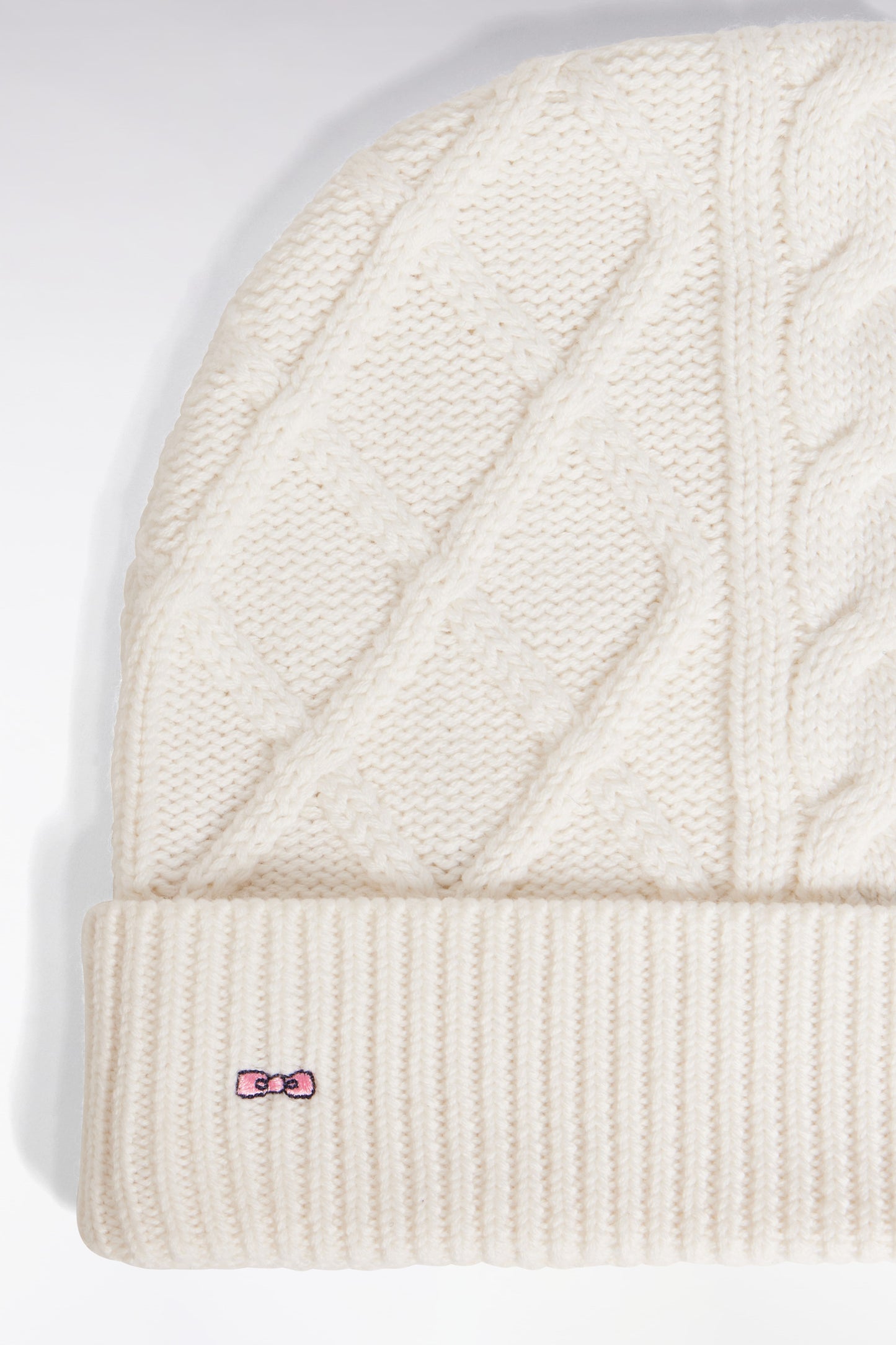 Bonnet à torsades en laine et coton blanc