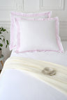 Set of square white cotton pillowcases with pink striped trim