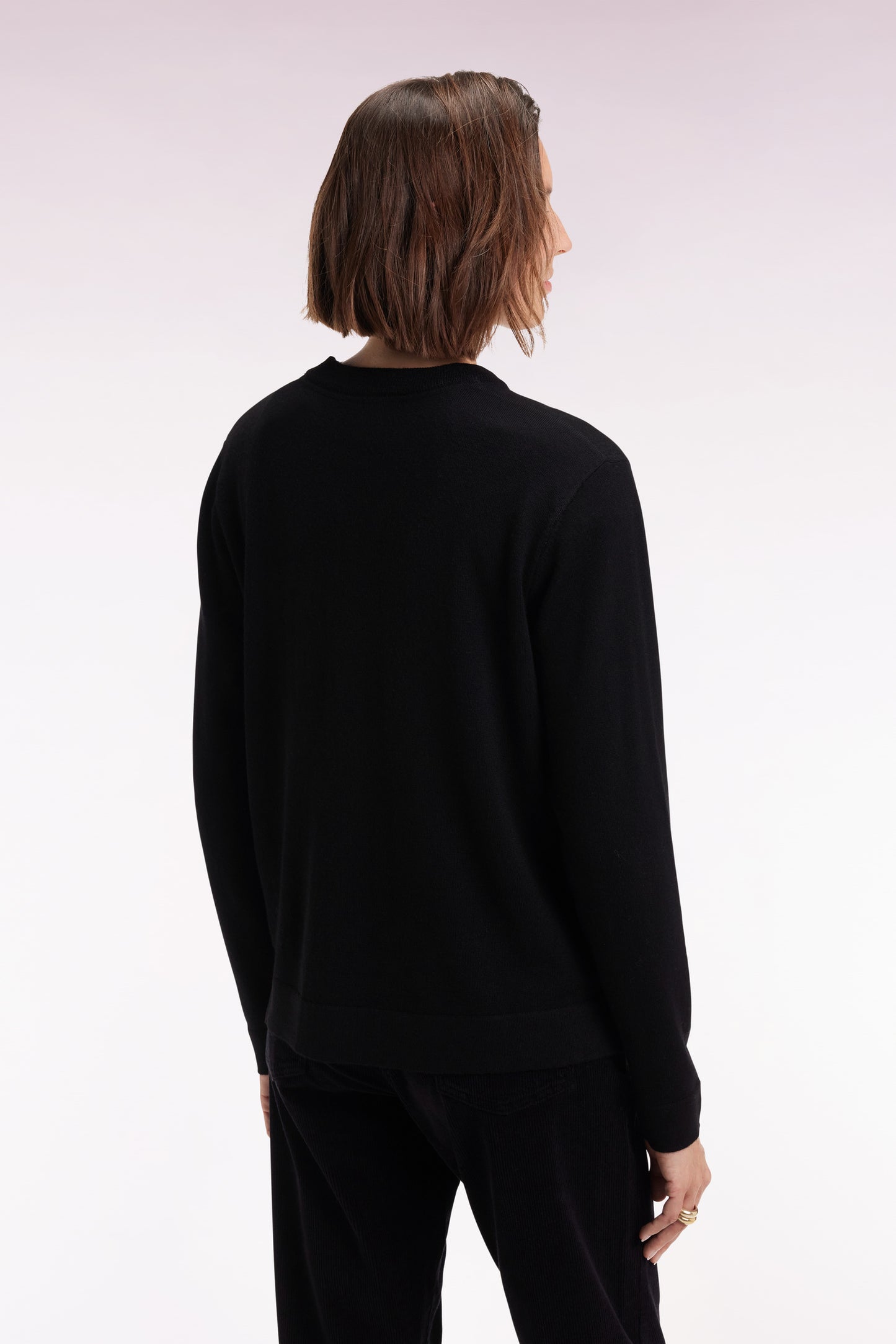 Round-neck sweater in black merino wool