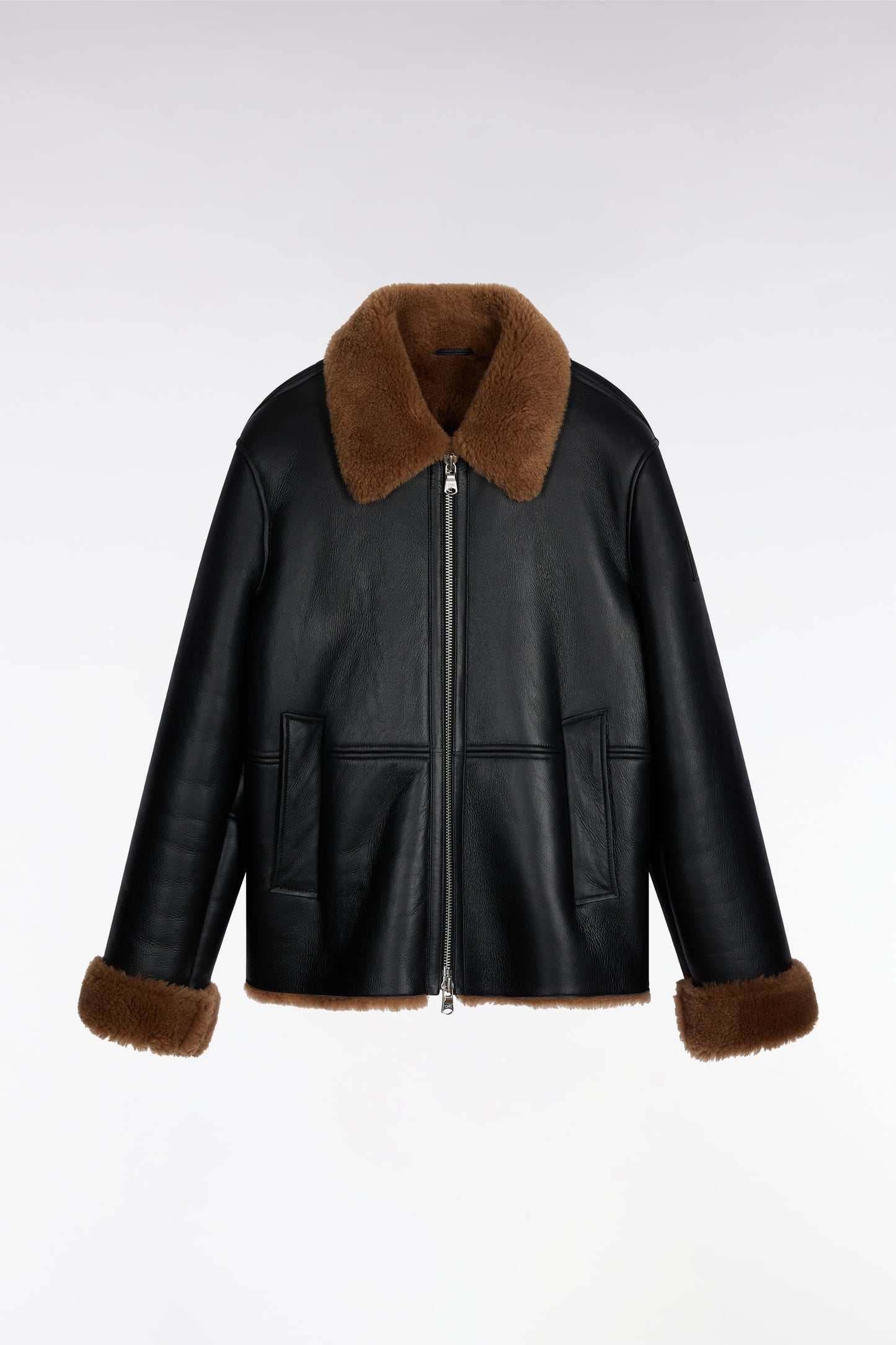 Blouson en peau lainée noir col marron
