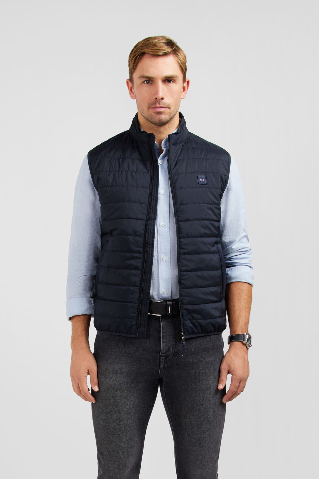 Navy blue sleeveless puffa jacket