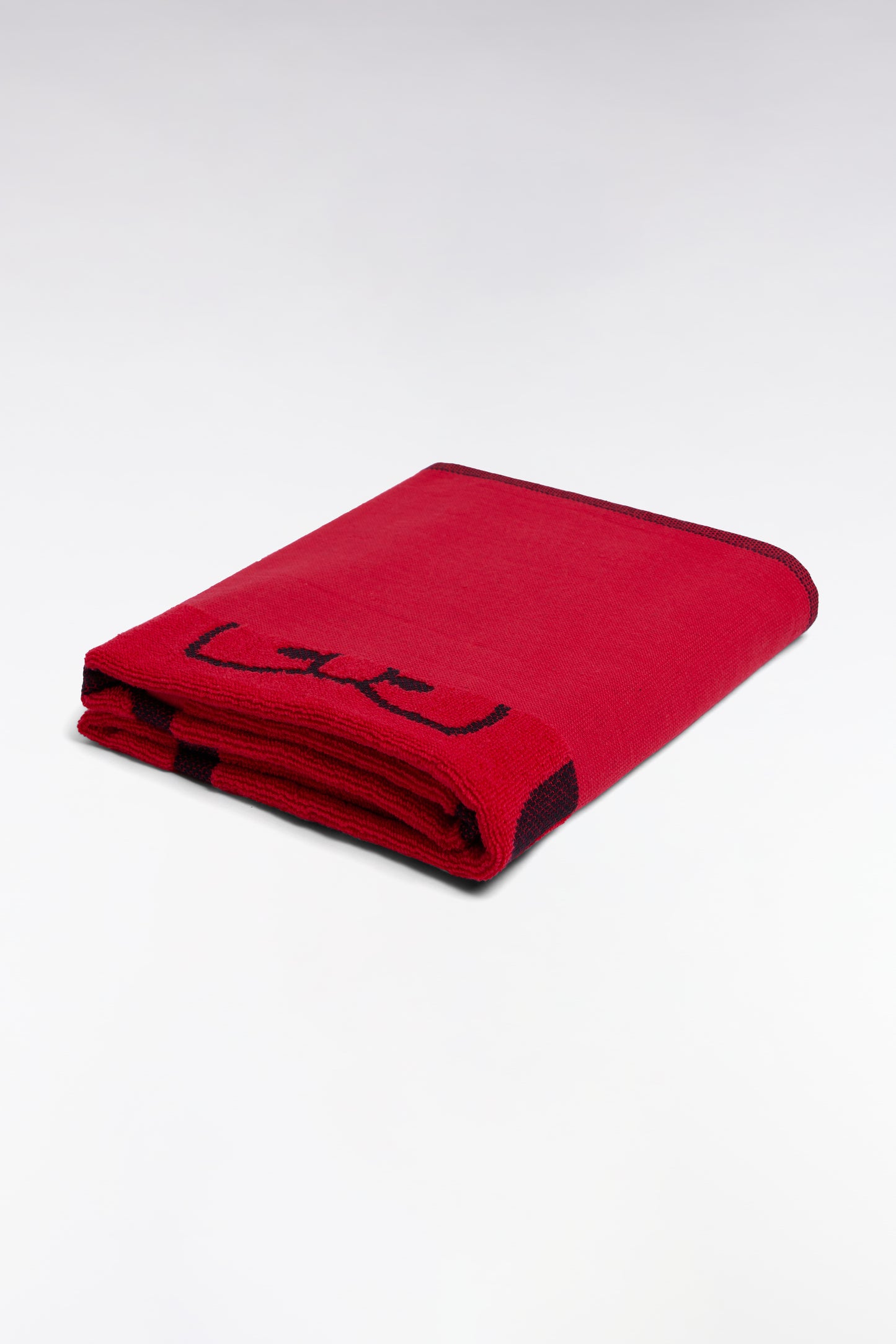 Fuchsia cotton terry beach towel with pink Eden Park jacquard