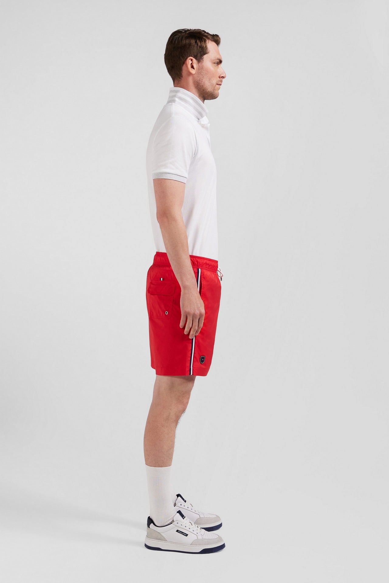 Short de bain uni détail bandes tricolores