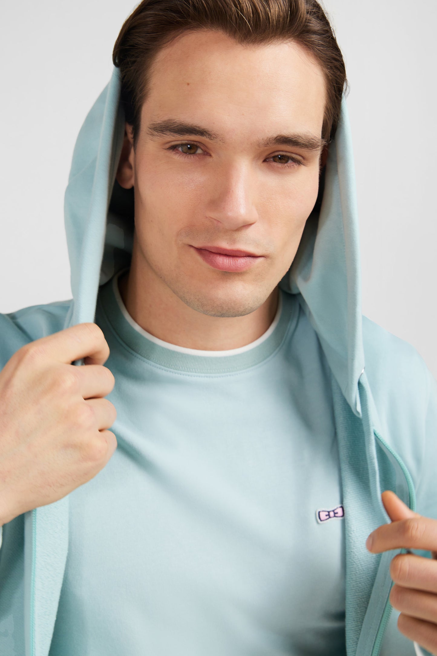 Green fleece zipped hoodie with bow tie embroidery