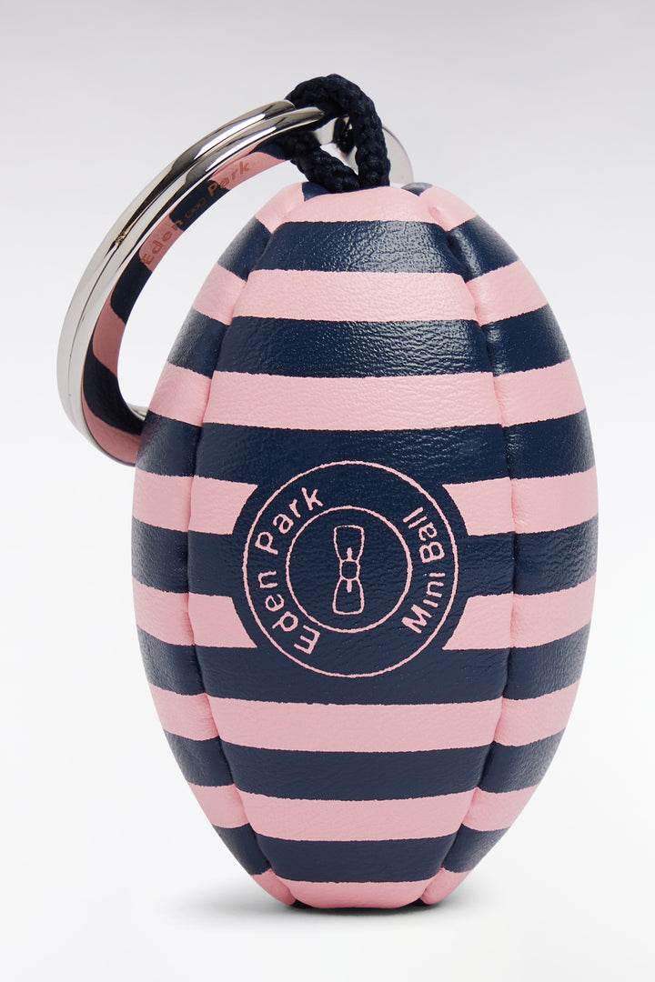 Porte-clefs ballon de rugby cerclé blanc et rose