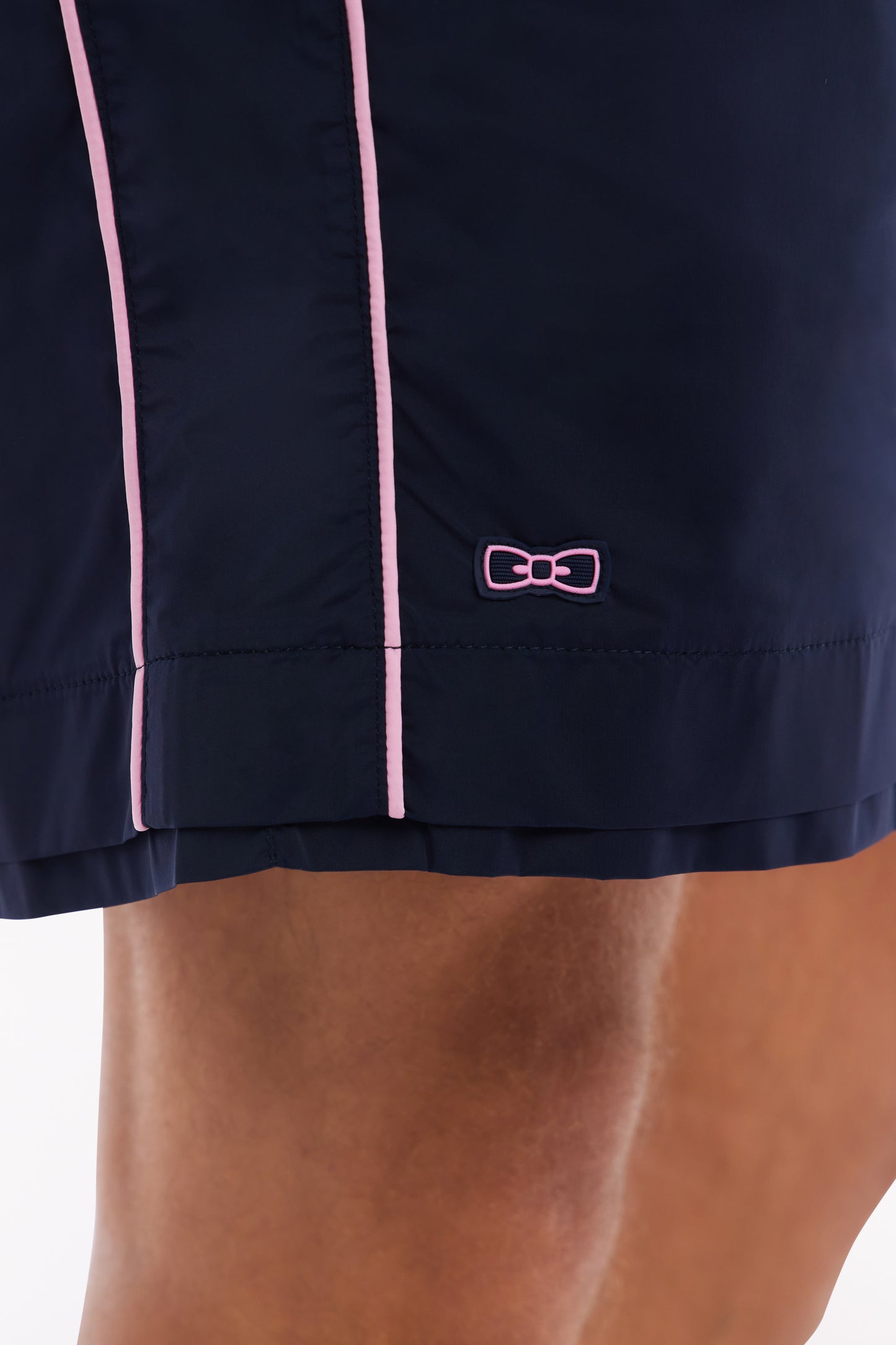 Maillot de bain marine à passepoil rose
