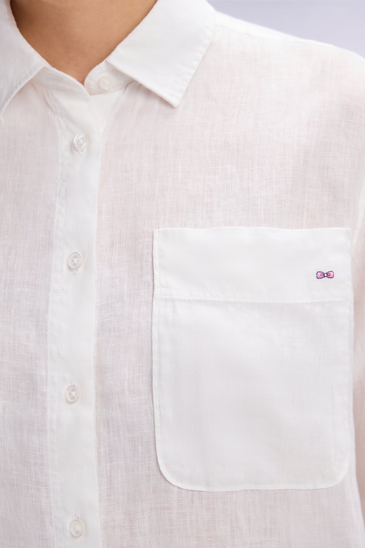 Oversized white linen shirt with patch pockets