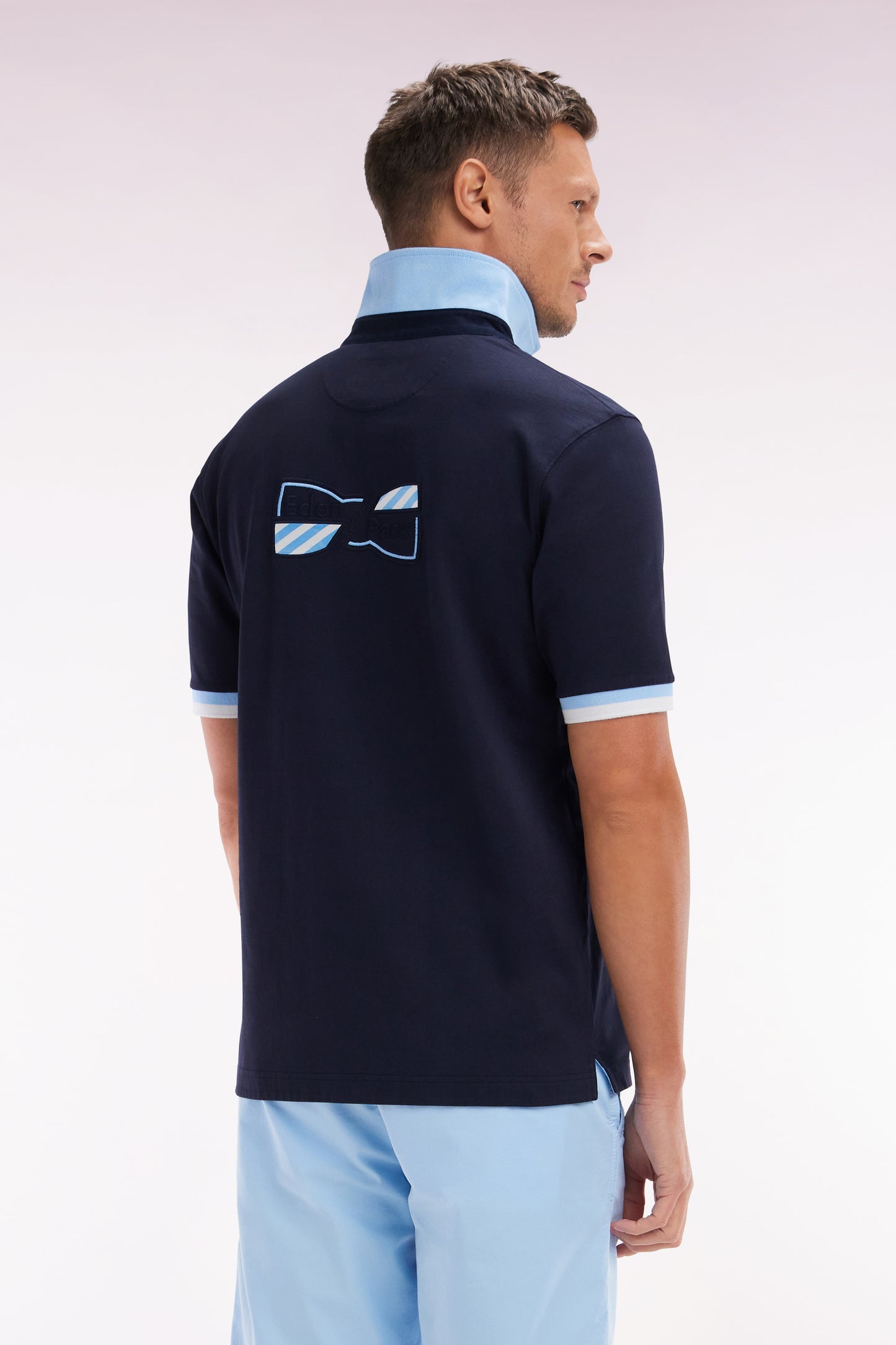 Straight-cut short-sleeved rugby shirt in navy cotton jersey with bow tie embroidery