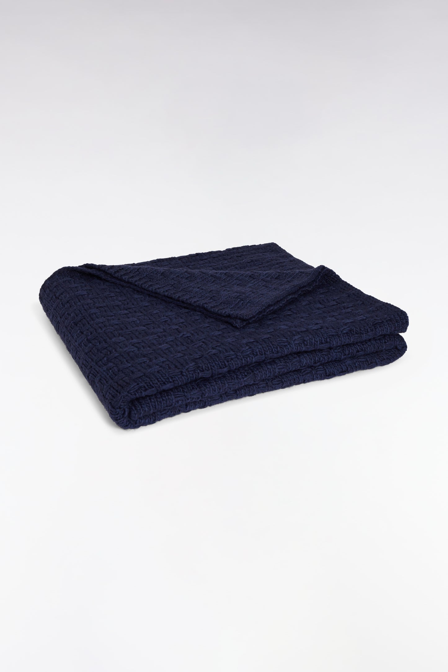Plaid tricoté marine motif nœuds papillon