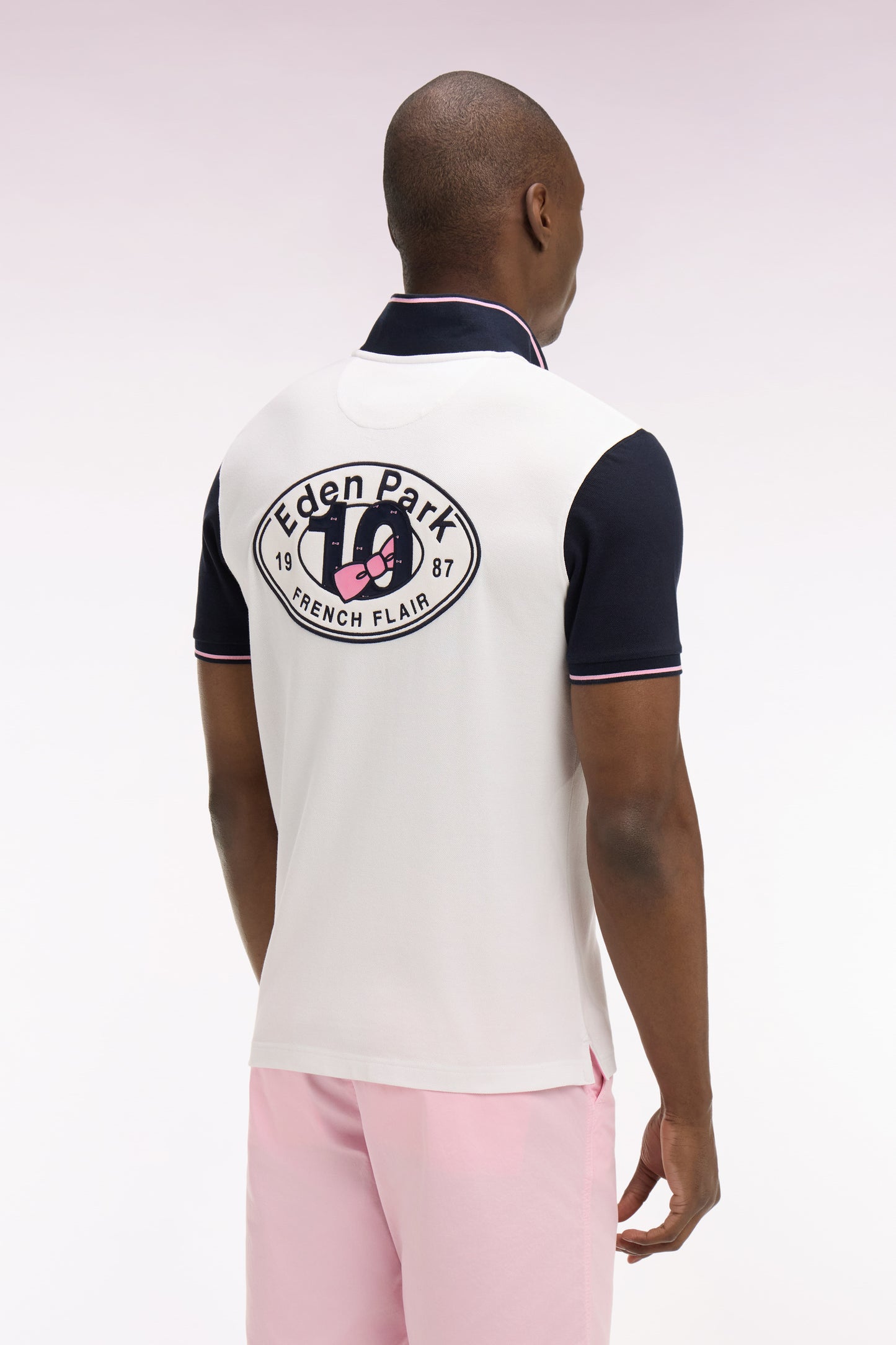 Short-sleeved white cotton pique polo shirt with back embroidery