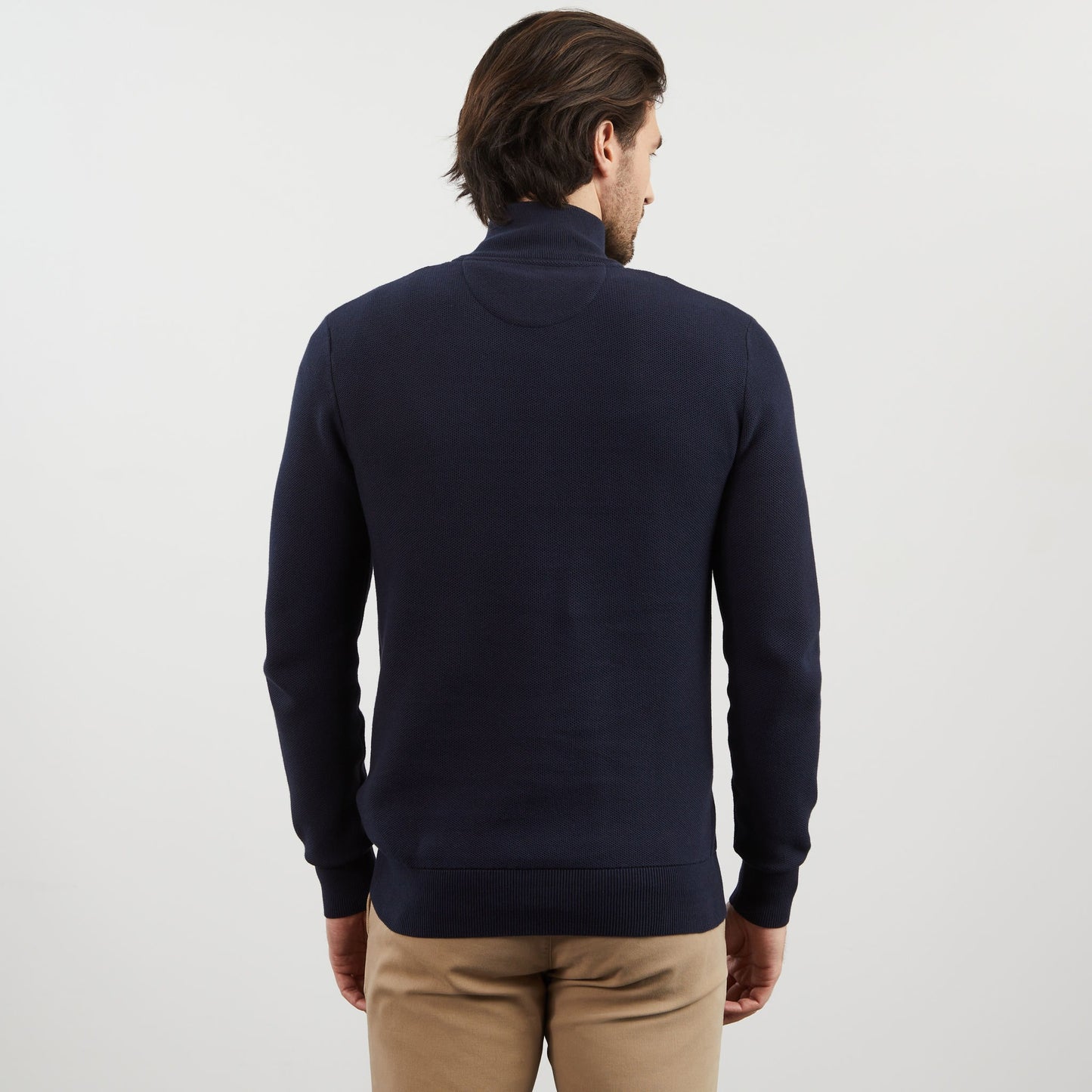 Dark blue zip-neck jumper in decorative cable knit
