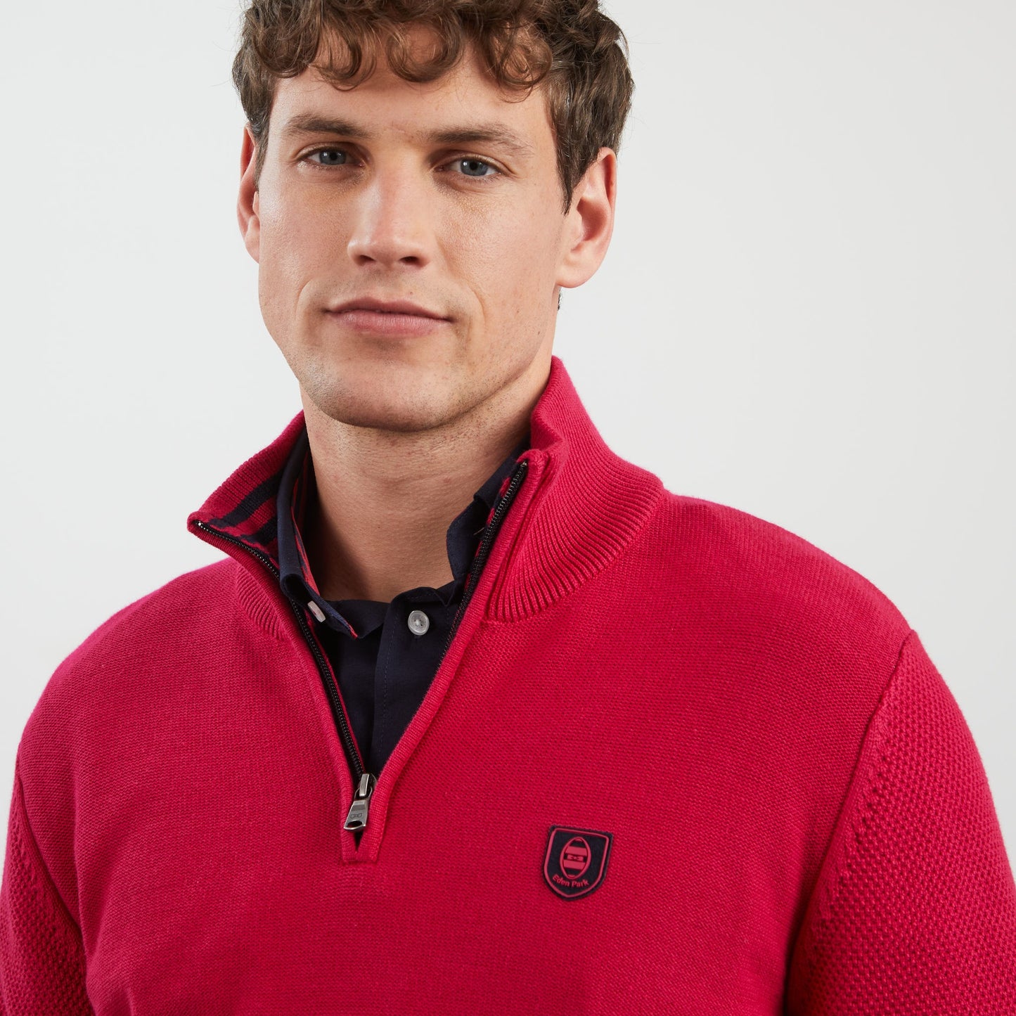 Dark pink zip-neck jumper with no. 10 embroidery