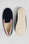 Navy blue shearling slippers with pink trim