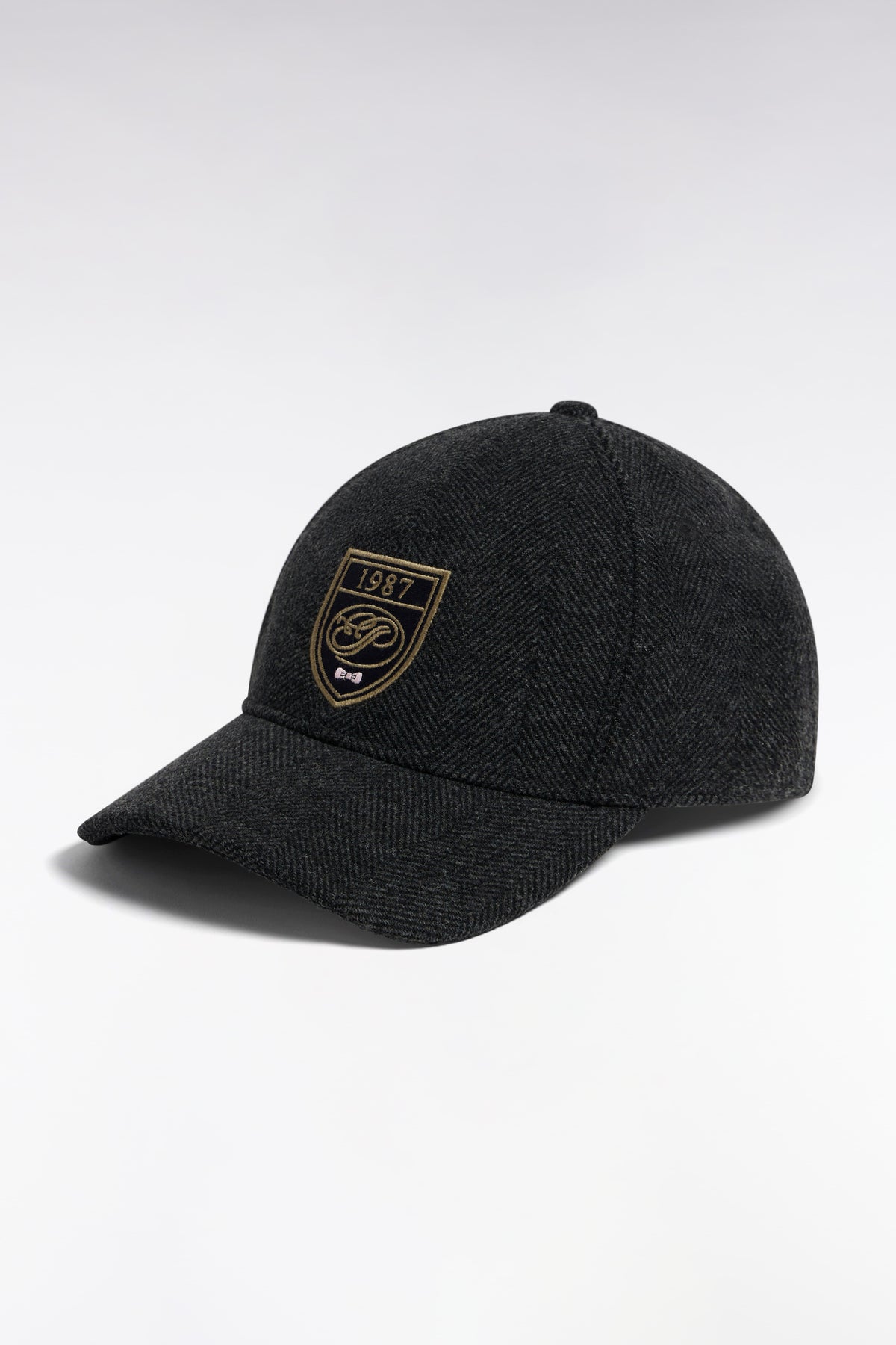 Charcoal herringbone woolen cloth cap with crest patch