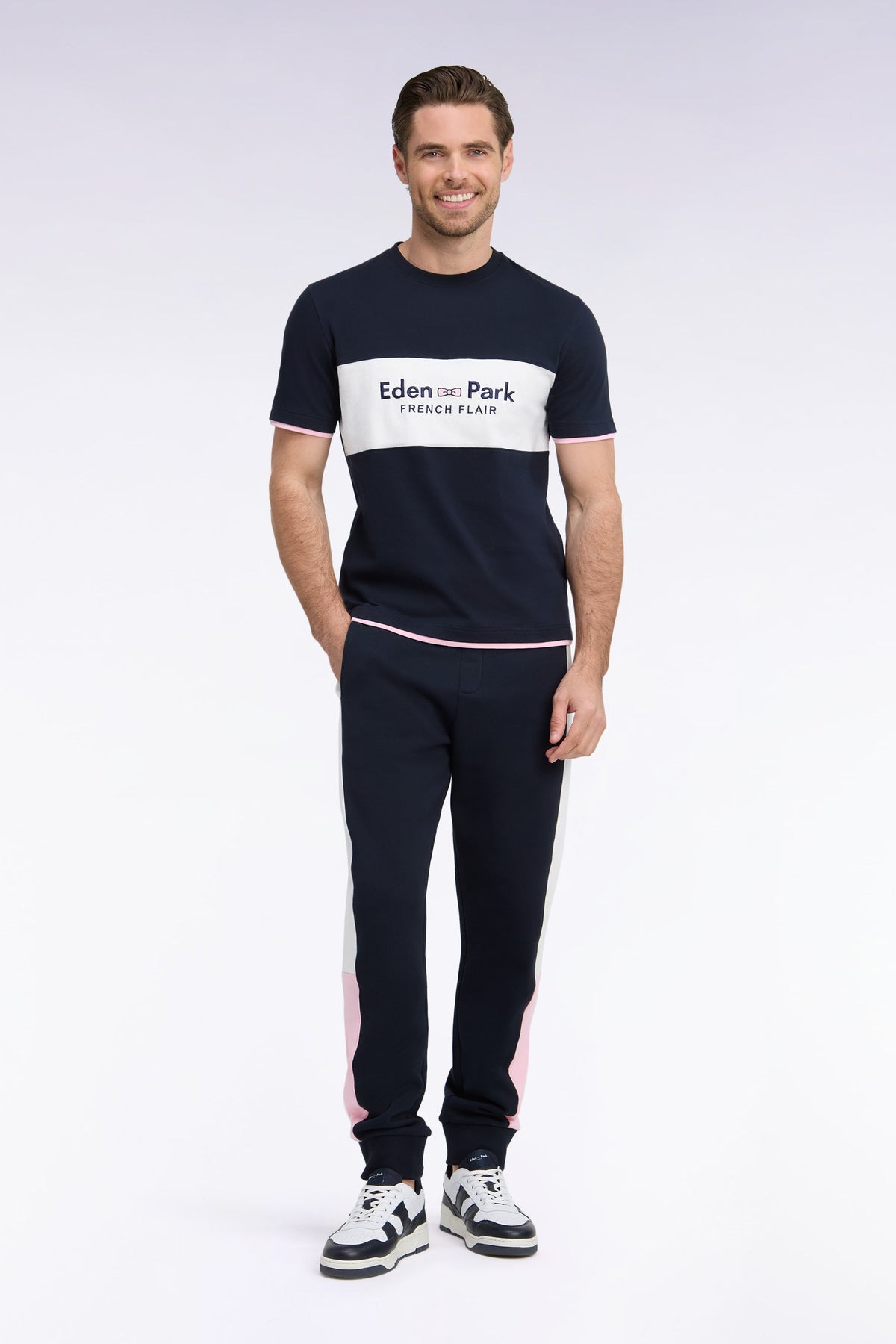 Navy fleece joggers with contrasting leg cutouts, straight cut
