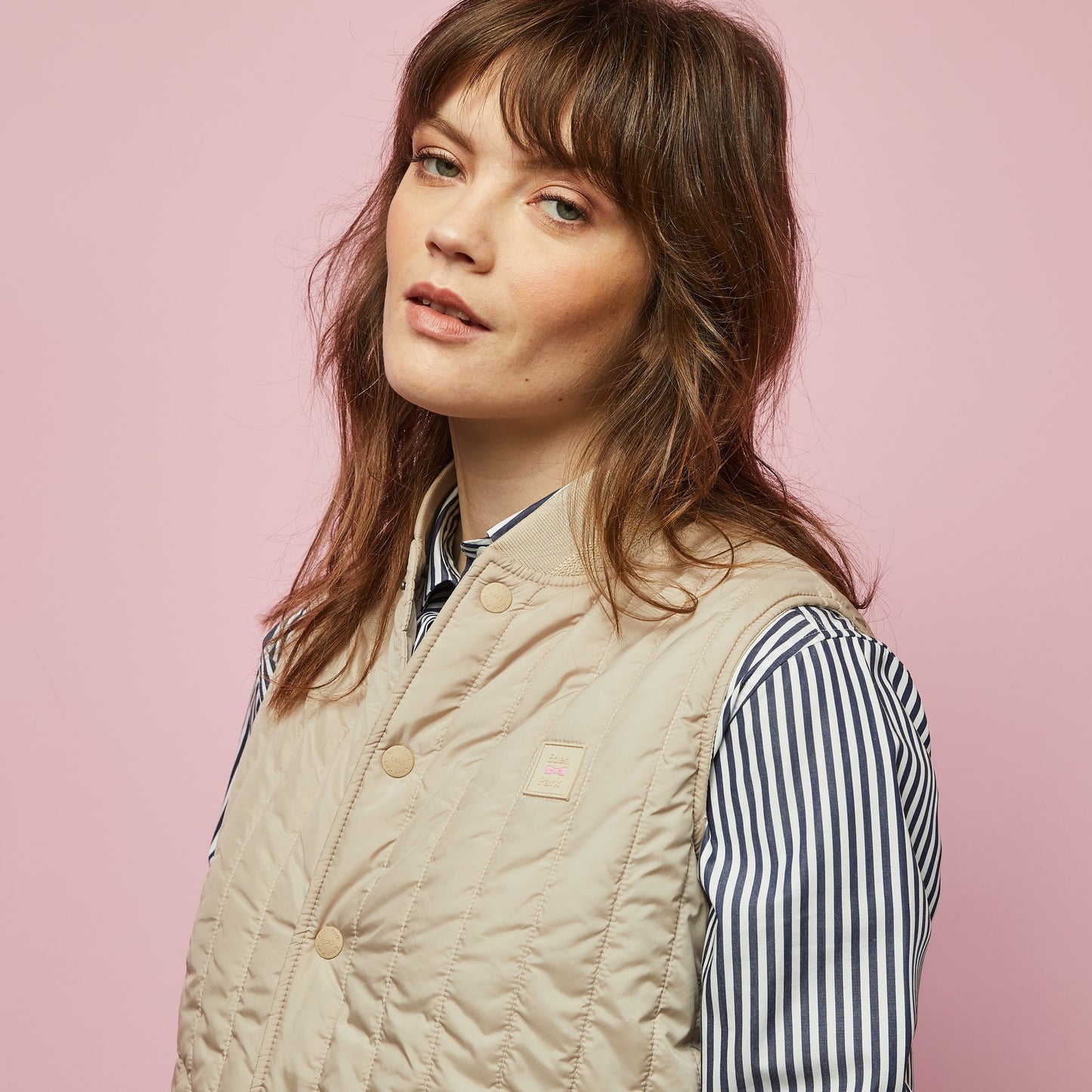 Beige sleeveless puffa jacket